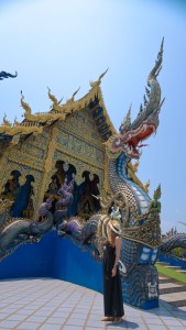 Woman visiting the Blue Temple, Wat Rong Suea Ten, in Chiang Rai, Thailand